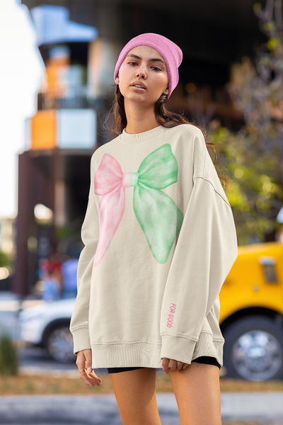 Pastel pink and green âWicked for Goodâ unisex sweatshirt with embroidered bow on chest and âfor goodâ sleeve embroidery, cozy cotton polyester blend, inclusive sizes Smallâ5XL. elphaba glinda sleeve for good pink green feminine coquette girly outfit matching pink beanie
