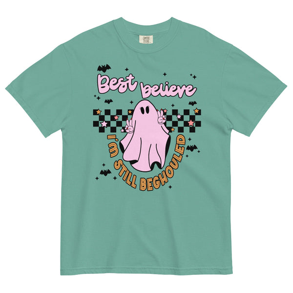 Purple graphic t-shirt with pink ghost making peace signs, black and white checkerboard background, bats, stars, and text ‘Best believe I’m still beghouled’ – cute Halloween Taylor Swift inspired tee. bejeweled midnights graphic tee taylor travis engaged green seafoam mint showgirl