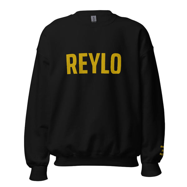 Embroidered sweatshirt that says REYLO on the front and you're not alone on the left sleeve. For Star Wars fans of Kylo Ren, Ben Solo and Rey. Shown in black with yellow embroidery.