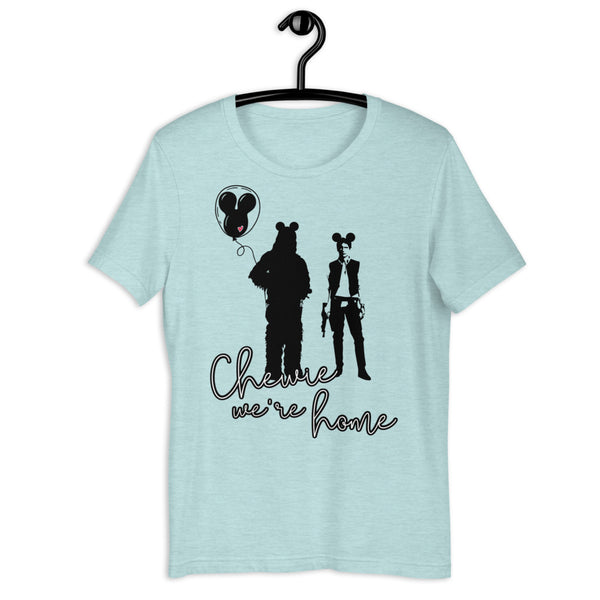 Chewie We're Home Shirt Disney Parks graphic tee Disneyland Disney WORLD Chewbacca holding a Mickey balloon with red heart and Han Solo wearing Mickey ears holding a blaster Neon 90's effect design font Heather ice blue with black and white design