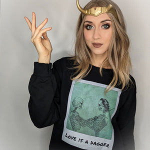 Woman wearing Love Is A Dagger Skeleton Halloween Sweatshirt by Shop Friday Apparel wearing Sylvie crown cosplay with Loki theme for Superhero Avenger's Campus comics outfit style