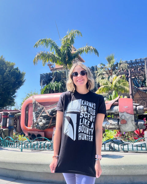 Karmas on your scent like a bounty hunter shirt disney swiftie star wars taylor swift eras tour midnights the mandalorian baby yoda grogu t-shirt graphic tee outfit disneyland disney world hollywood studios galaxy's edge batuu woman at galaxy's edge downtown disney star trader store rey skywalker ship tatooine jakuu