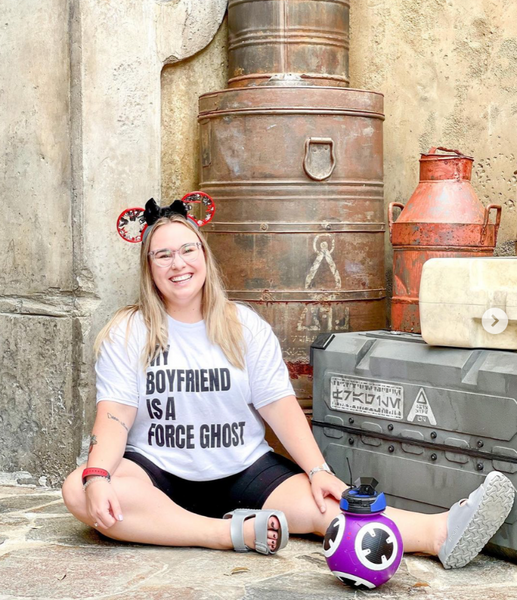 my boyfriend is a force ghost shirt star wars halloween graphic tee outfit costume kylo ren obi wan kenobi anakin skywalker darth vader qui gon jinn han solo yoda red qimir acolyte palpatine sith woman sitting at galaxy's edge batuu disneyland with droid kylo ren mickey ears