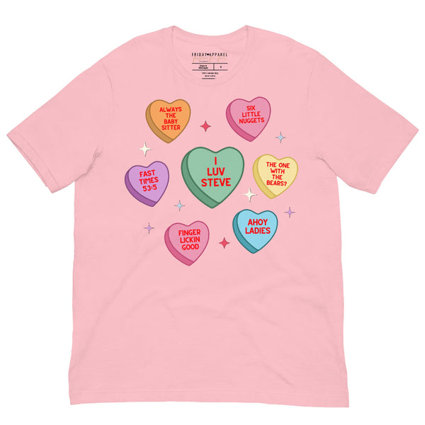 Unisex pink t-shirt with Steve Harrington inspired candy heart Valentine design featuring “I Luv Steve” and retro sayings