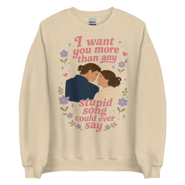 Brown beige unisex sweatshirt featuring Anakin and Padmé with floral artwork and the quote "I want you more than any stupid song could ever say," inspired by Olivia Rodrigo and Star Wars. Romantic fandom sweatshirt for Disney fans.