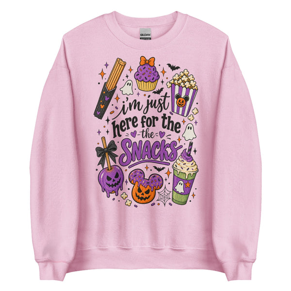 I’m Just Here for the Snacks Halloween sweatshirt featuring spooky theme park inspired treats in purple, orange and black.