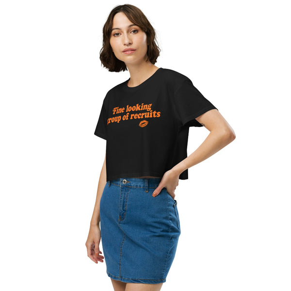 Black cropped graphic t-shirt with distressed orange “Fine Looking Group of Recruits” lettering and small kiss graphic.