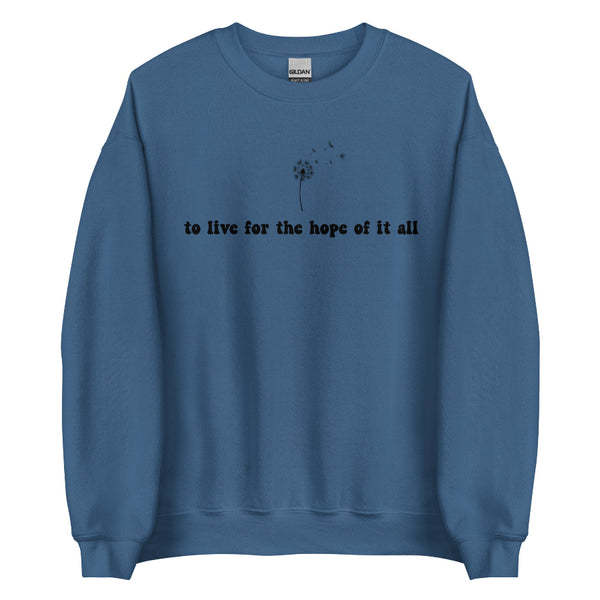 Blue folklore-inspired sweatshirt with “to live for the hope of it all” text and delicate dandelion design