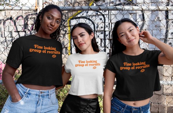 Black and White cropped graphic t-shirt with distressed orange “Fine Looking Group of Recruits” lettering and small kiss graphic.