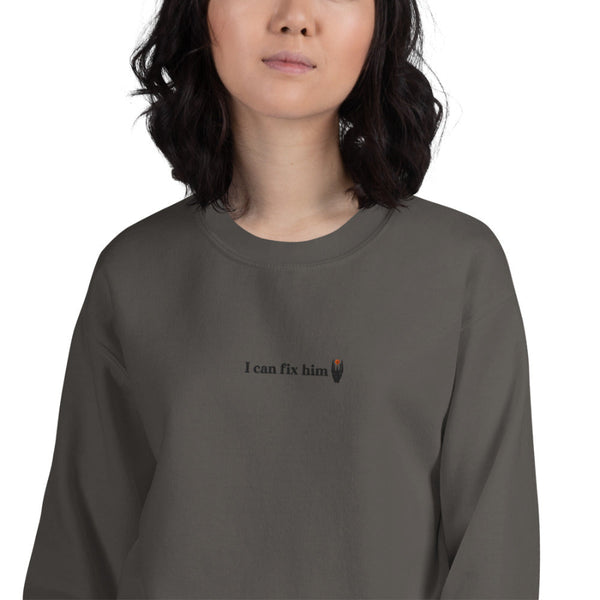 Dark gray unisex embroidered sweatshirt featuring the phrase "I can fix him" stitched in small black lettering on the left chest. Minimalist fantasy-inspired embroidered crewneck for Lord of the Rings fans.