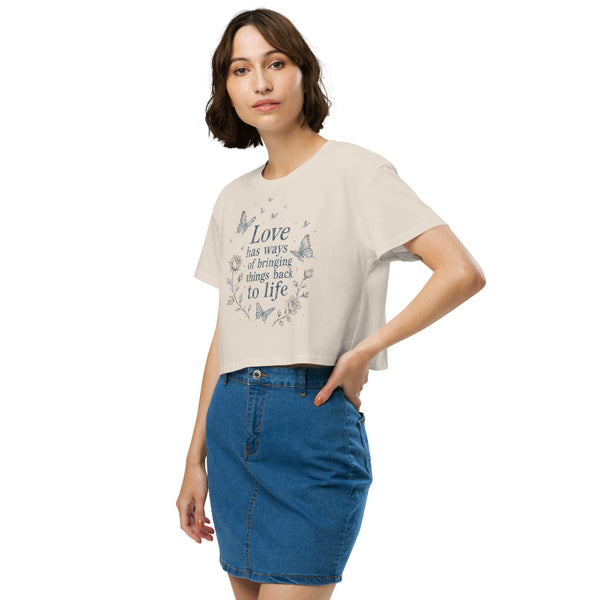 Love Has Ways Butterfly women’s cropped t-shirt featuring blue butterflies and a hopeful inspirational quote