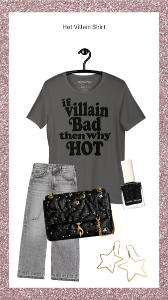 A styled outfit flat-lay featuring a dark gray graphic t-shirt with the text 'if villain Bad then why HOT' in black, paired with light-wash distressed jeans, a black studded quilted handbag, gold star earrings, and a black nail polish bottle, all arranged on a white background with a pink glitter border.