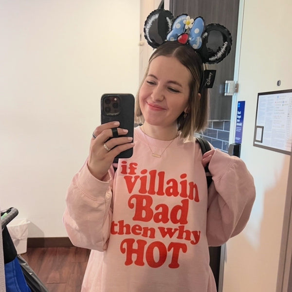 Pink retro-style sweatshirt reading “If Villain Bad Then Why Hot” for fandom and villain lovers