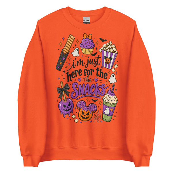 I’m Just Here for the Snacks Halloween sweatshirt featuring spooky theme park inspired treats in purple, orange and black.