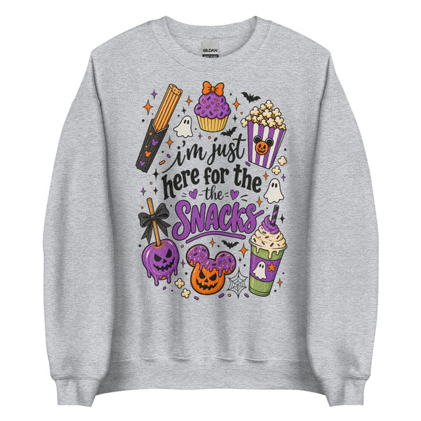 I’m Just Here for the Snacks Halloween sweatshirt featuring spooky theme park inspired treats in purple, orange and black.