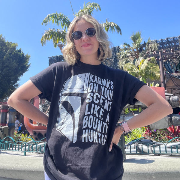 Karmas on your scent like a bounty hunter shirt disney swiftie star wars taylor swift eras tour midnights the mandalorian baby yoda grogu t-shirt graphic tee outfit disneyland disney world hollywood studios galaxy's edge batuu woman at galaxy's edge downtown disney star trader store rey skywalker ship tatooine jakuu