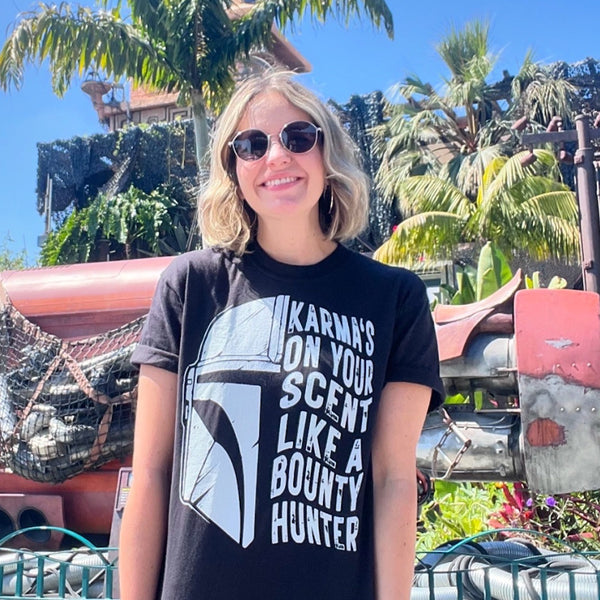 Karmas on your scent like a bounty hunter shirt disney swiftie star wars taylor swift eras tour midnights the mandalorian baby yoda grogu t-shirt graphic tee outfit disneyland disney world hollywood studios galaxy's edge batuu woman at galaxy's edge downtown disney star trader store rey skywalker ship tatooine jakuu