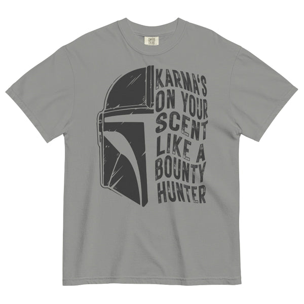 A gray short-sleeve crewneck t-shirt featuring a distressed black graphic of the Mandalorian helmet next to the text 'KARMA'S ON YOUR SCENT LIKE A BOUNTY HUNTER'.
