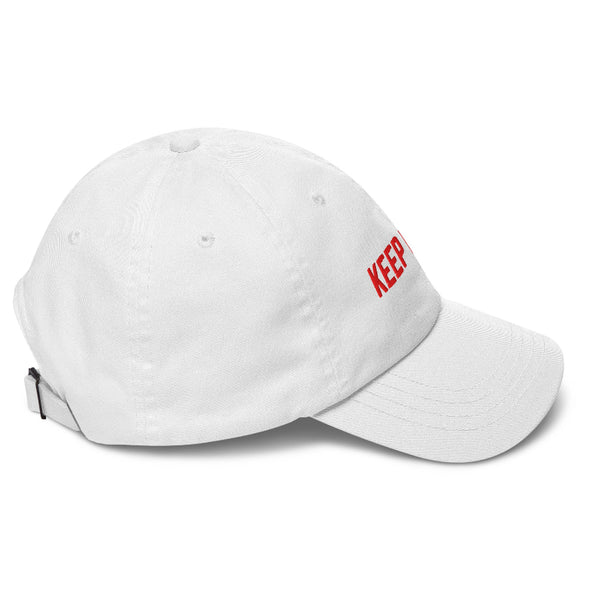 Minimalist embroidered Keep It 100 dad hat in camouflage, black, and white color options