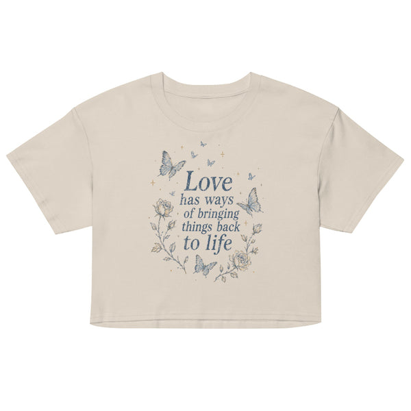Love Has Ways Butterfly women’s cropped t-shirt featuring blue butterflies and a hopeful inspirational quote