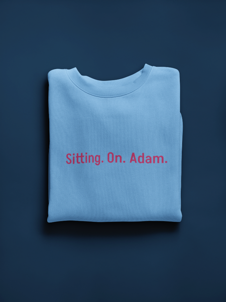 Unisex crewneck sweatshirt with a small romance book quote embroidered across the center chest.
