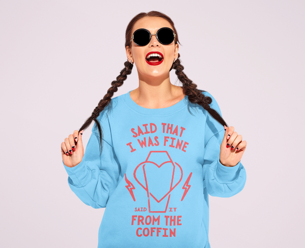 Woman wearing Gracie Abrams lyrics sweatshirt Said that I was fine said it from the coffin That's So True the secret of us deluxe music top shirt in blue with red design. Two brown french waterfall braids and black round sunglasses.