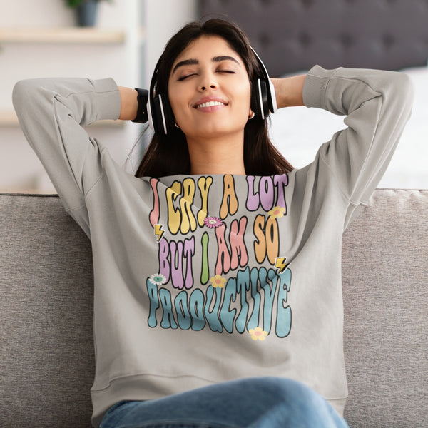 Woman wearing I Can Do It With A Broken Heart quote sweatshirt in grey gray that says I cry a lot but I am so productive. Grey sweatshirt with flowers and lightning bolt and smiley faces. Taylor Swift inspired Eras Tour top shirt.