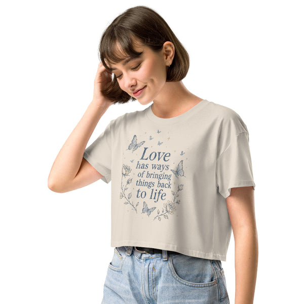 Love Has Ways Butterfly women’s cropped t-shirt featuring blue butterflies and a hopeful inspirational quote