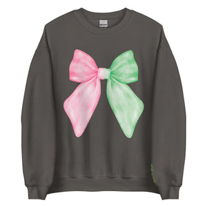 Pastel pink and green ‘Wicked for Good’ unisex sweatshirt with embroidered bow on chest and ‘for good’ sleeve embroidery, cozy cotton polyester blend, inclusive sizes Small–5XL. elphaba glinda sleeve for good pink green feminine coquette girly outfit matching