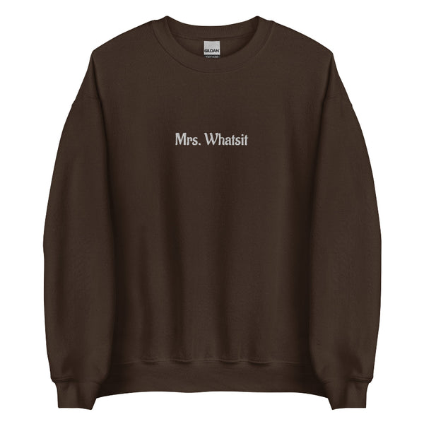 Brown unisex sweatshirt with white embroidered ‘Mrs. Whatsit’ text, Stranger Things inspired minimalist crewneck.
