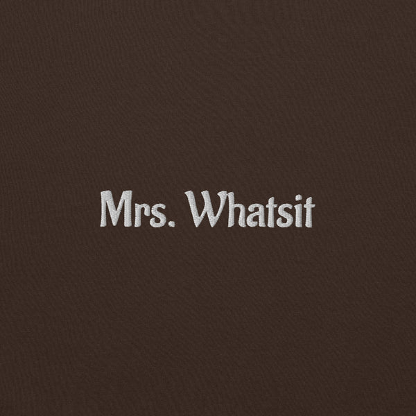 Brown unisex sweatshirt with white embroidered ‘Mrs. Whatsit’ text, Stranger Things inspired minimalist crewneck.