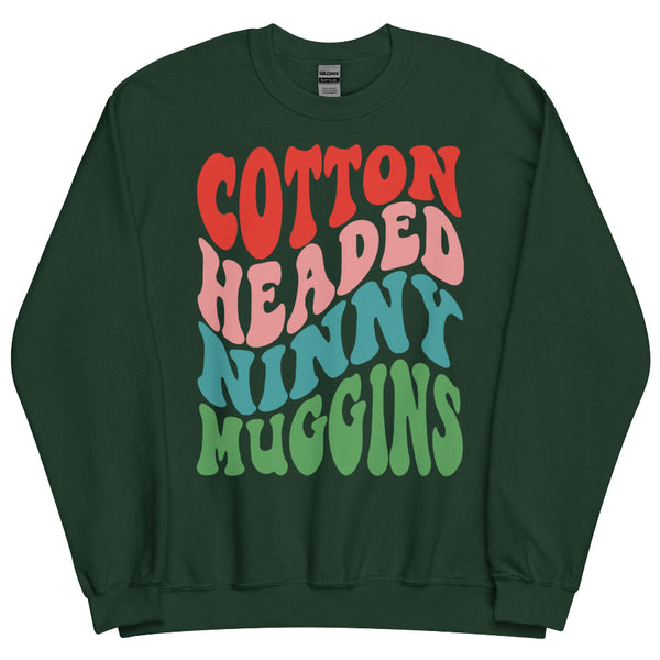 Forest green unisex sweatshirt with colorful retro text reading “Cotton Headed Ninny Muggins” inspired by Elf.