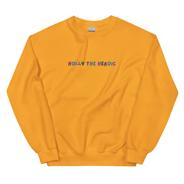 Mustard yellow unisex embroidered sweatshirt with colorful stitched text reading ‘Holly the Heroic,’ Stranger Things inspired Holly Wheeler fan design.