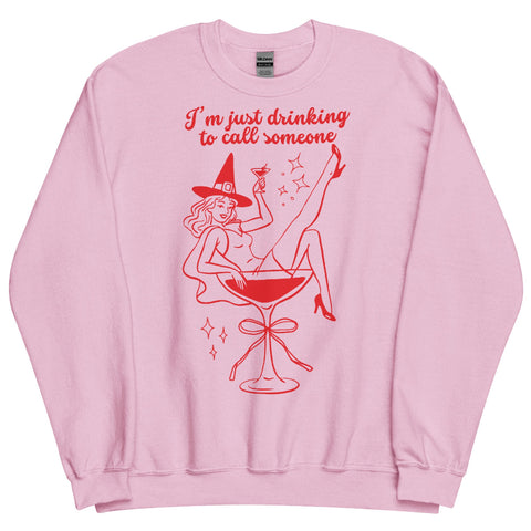 Pink ‘I’m Just Drinking to Call Someone’ witch Halloween sweatshirt with retro cocktail glass design, cozy cotton polyester blend, unisex sizing. sweater jumper pullover hoodie top shirt sabrina carpenter go go juice witch costume mans best friend