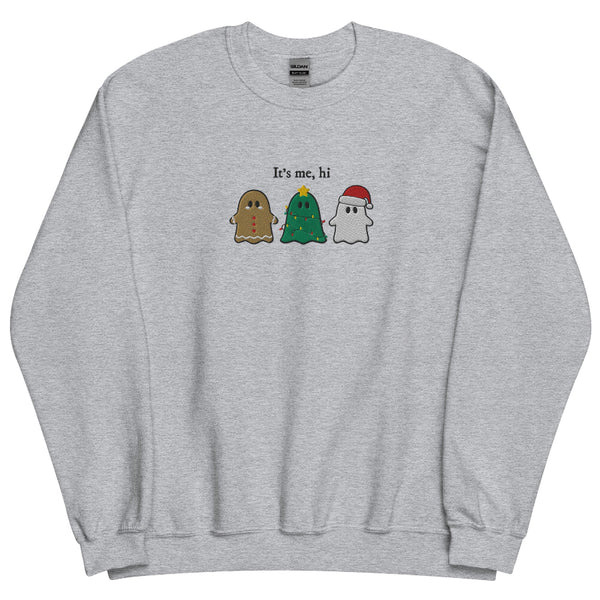 “It’s Me, Hi” embroidered Christmas sweatshirt showing three festive ghost characters—a gingerbread ghost, a Christmas-tree ghost with lights, and a Santa ghost—stitched on a sage green unisex crewneck. Taylor Swift swift midnights anti hero music lyrics holiday gift