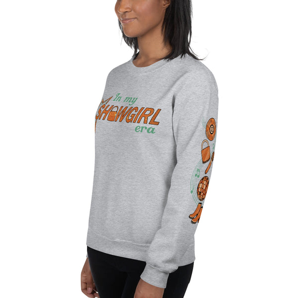 Music notes sleeve design on black unisex sweatshirt featuring record, lock, microphone, disco ball, and boots icons in copper tones. the life of a showgirl in my showgirl eras sweater left sleeve design print taylor swift swiftie vinyl TS12 microphone mirrorball boots outfit gift