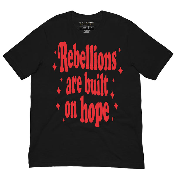 Unisex graphic t-shirt with pink lettering that reads “Rebellions Are Built on Hope,” inspired by sci-fi rebellion themes.