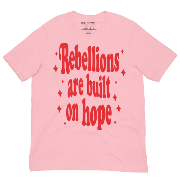Unisex graphic t-shirt with pink lettering that reads “Rebellions Are Built on Hope,” inspired by sci-fi rebellion themes.