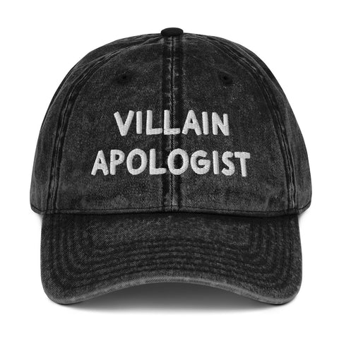 Villain Apologist embroidered baseball cap. Black grunge bleached wash fabric with white embroidered thread design.