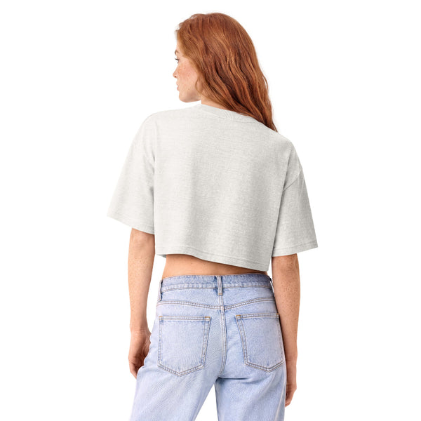 Woman wearing a vintage garment-dyed cropped tee featuring an adorable bubble tea-inspired Wookiee design. Relaxed washed Bella + Canvas cropped t-shirt for Galaxy's Edge outfits, Disneyland trips, bubble tea lovers, and subtle fandom fashion.