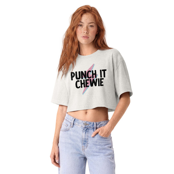 Woman wearing a vintage garment-dyed cropped tee featuring the phrase "Punch It, Chewie!" Relaxed washed Bella + Canvas cropped t-shirt inspired by Han Solo and Chewbacca, perfect for Millennium Falcon: Smugglers Run, Galaxy's Edge outfits, and Batuu adventures.