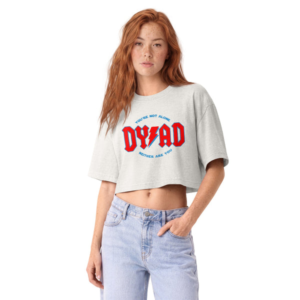 Woman wearing a vintage garment-dyed cropped tee featuring a celestial Dyad in the Force inspired design. Relaxed washed Bella + Canvas cropped t-shirt for Reylo fans, Ben Solo fans, Galaxy's Edge outfits, and subtle fandom fashion.