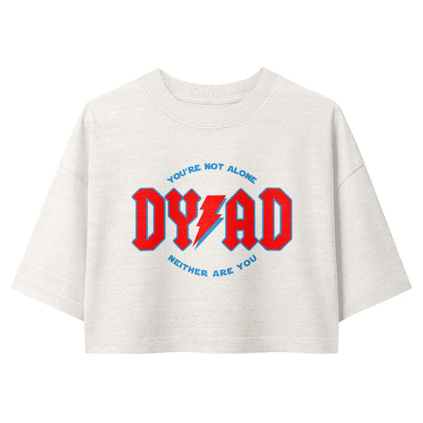 Woman wearing a vintage garment-dyed cropped tee featuring a celestial Dyad in the Force inspired design. Relaxed washed Bella + Canvas cropped t-shirt for Reylo fans, Ben Solo fans, Galaxy's Edge outfits, and subtle fandom fashion.