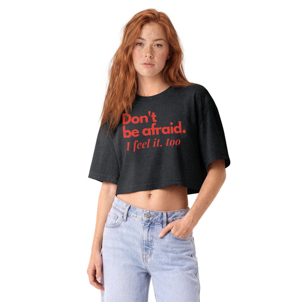Woman wearing a vintage garment-dyed cropped tee featuring a Don't Be Afraid inspired design. Relaxed washed Bella + Canvas cropped t-shirt for Kylo Ren fans, Reylo readers, Galaxy's Edge outfits, and subtle fandom fashion.