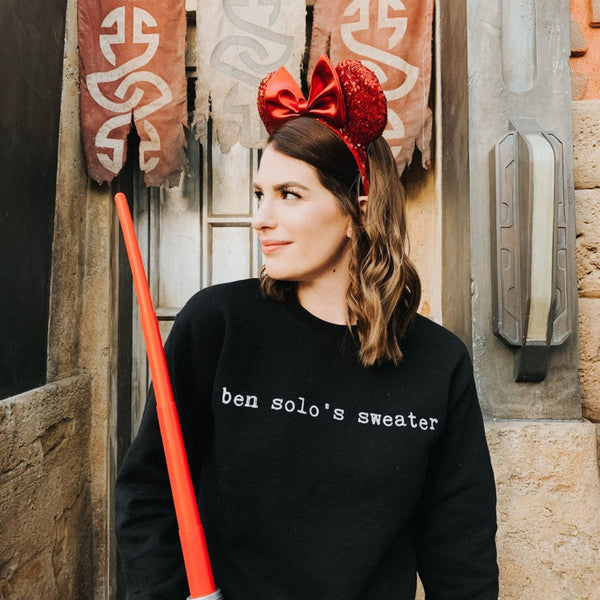 The Original Ben Solo's Sweater worn at Galaxy's Edge Disneyland Disney World with Kylo Ren's red dark side lightsaber and red mickey ears. Available in Small-4XL, size inclusive. Comfy unisex fit for men and women. Worldwide shipping.