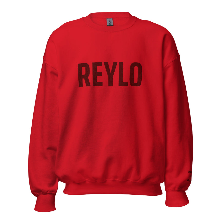 Embroidered sweatshirt that says REYLO on the front and you're not alone on the left sleeve. For Star Wars fans of Kylo Ren, Ben Solo and Rey. Shown in red with dark red embroidery.